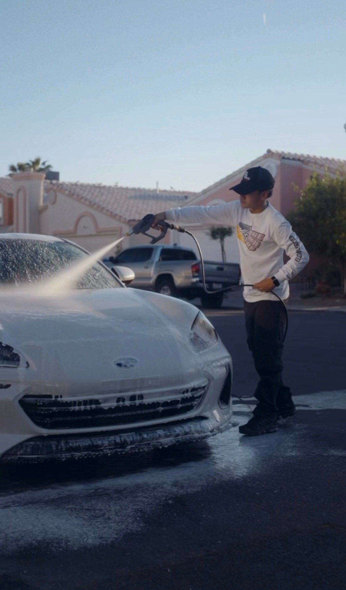 ALRO Details foam washing a car in a Las Vegas driveway